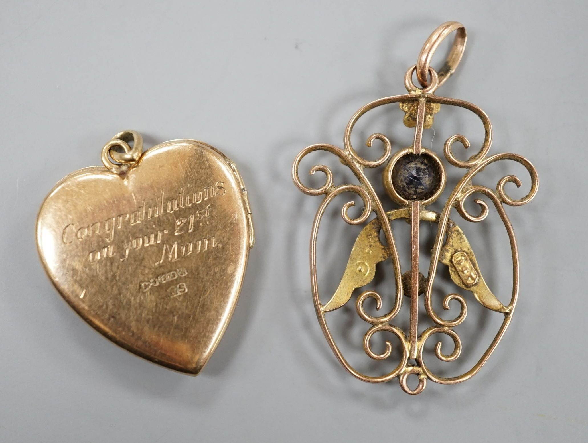 A 9ct gold heart shaped locket, with engraved inscription, 22mm and an Edwardian 9ct, amethyst and seed pearl set pendant